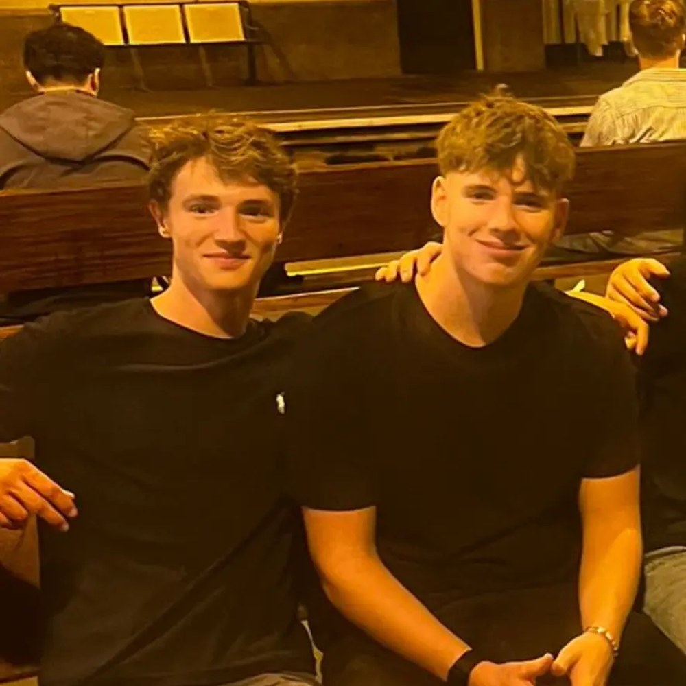 Sam and Alex sitting on a bench late at night